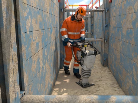 Abb. 93 Verdichtungsarbeiten mit einem Akku betriebenen Stampfer